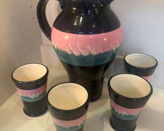 Signed hand painted pottery pitcher with 4 cups