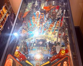 Lord of the Rings pinball machine by Stern Pinball Inc, works great. Videos available to see it working and hear the audio. Available for Pre-sale.  75"h x 30"w x 50"d