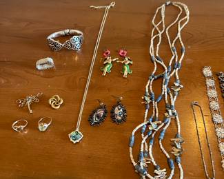 Some gold, a T & Co silver mesh ring… some Kendra Scott, great Carved abalone fetish necklace… Cool Brighton clamp bracelet that I believe is retired and some awesome articulated hula dancer earrings: true vintage! Close-ups of these pieces are at the end of the pictures