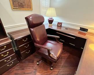 Killer ox blood colored leather high back rolling desk chair. Very comfy and super fancy!