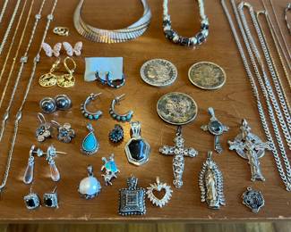 More sterling, a few US antique silver coins… Lots of crosses real cool synthetic opal turtle and baby turtle pendant… Beautiful rose gold colored Sterling Pavé diamond earrings