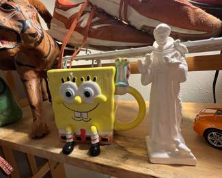 A SpongeBob coffee mug & a Goebel Saint Francis… Naturally the best of friends; they share loves of both quite introspection & deep sea diving. They don’t talk much, but they don’t need to.