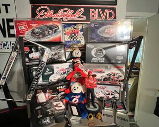 Yep… Right there in the center of the top is a real deal Dale Earnhardt Sr. signed mini car on the card!