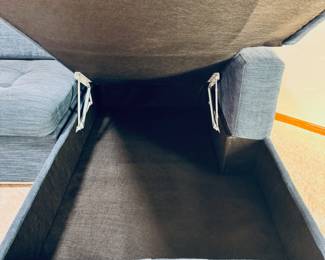 Very nice Article Brand ‘Soma’ sectional sleeper sofa with large storage compartment in blue indigo upholstery.  Measures 106” long x 63” deep