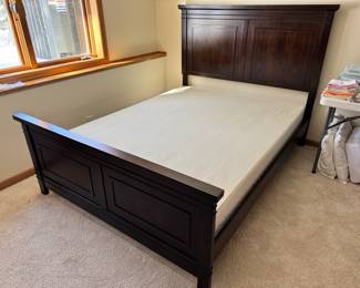 Queen Size wood bed frame.  Box spring sold separately 