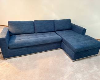 Very nice Article Brand ‘Soma’ sectional sleeper sofa with large storage compartment in blue indigo upholstery.  Measures 106” long x 63” deep