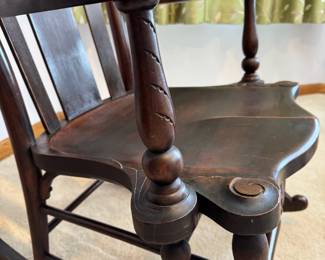 Antique mahogany rocking chair with hand carved Parrot arms, attributed to the Milwaukee Chair Co. 