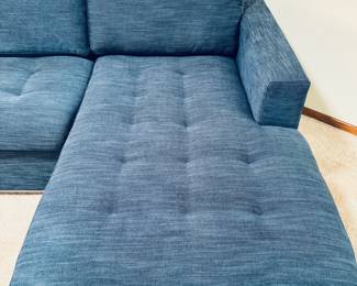 Very nice Article Brand ‘Soma’ sectional sleeper sofa with large storage compartment in blue indigo upholstery.  Measures 106” long x 63” deep
