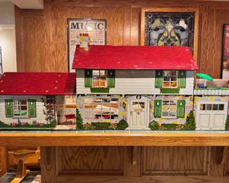 Vintage Marx tin litho Disney dollhouse with a large assortment of accessories and original family car