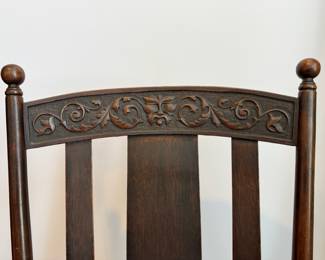 Antique mahogany rocking chair with hand carved Parrot arms, attributed to the Milwaukee Chair Co. 