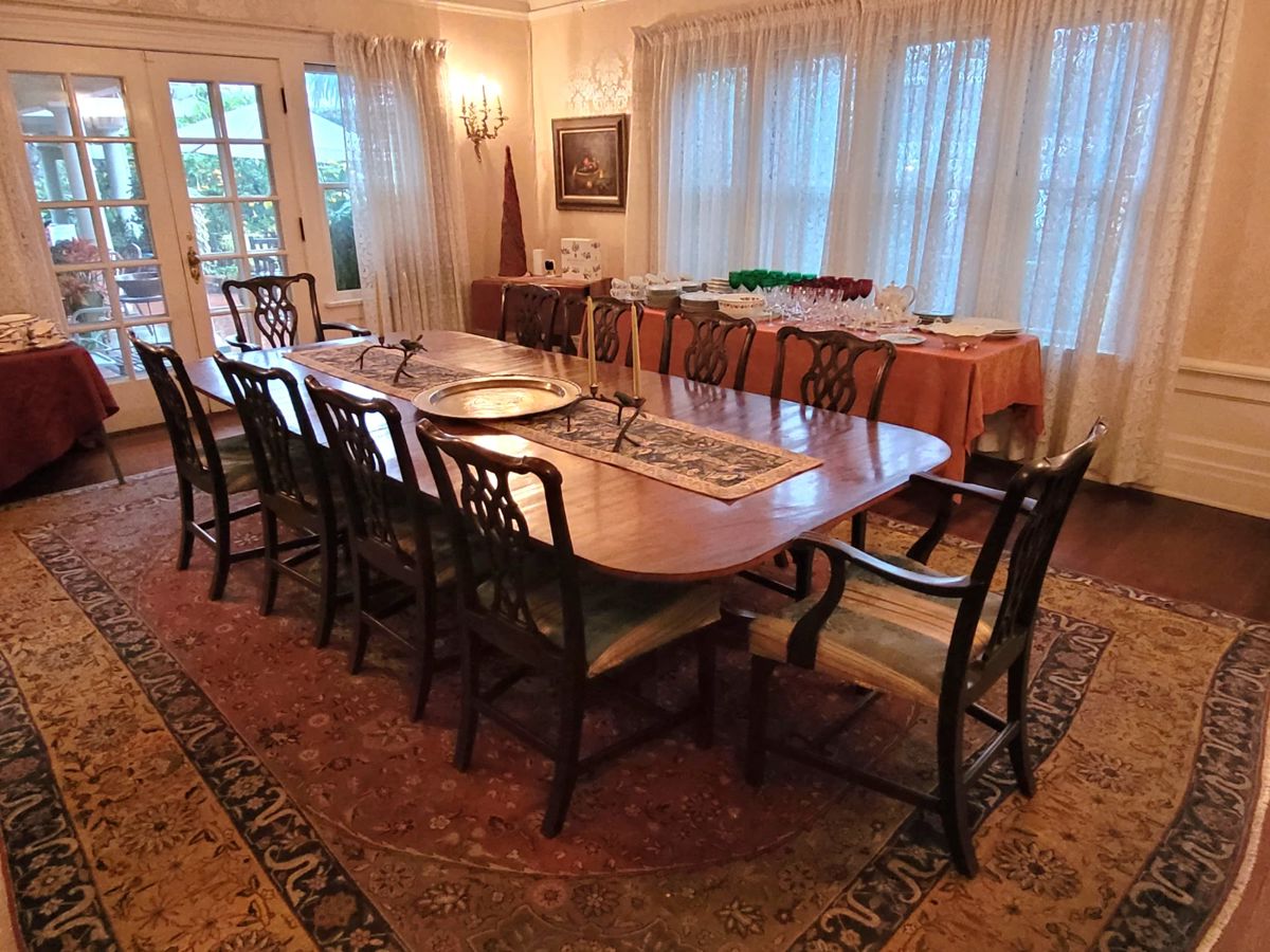 12 ft adjustable classic mahogany pedestal table. 10 Chippendale mahogany chairs