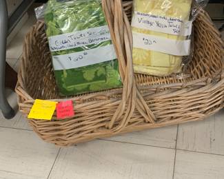 Several large baskets and MCM towel sets