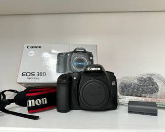 R3 - $300. Canon EOS 30D Digital Camera with battery, battery charger, cap, strap, and manuals.