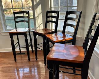R14 - $100. Set of 4 Wooden Bar Stools. Measures 16" wide x 16" deep x 30" floor to seat. Floor to back is 46" tall. Stained Black & Wooden Seats - all show little bits of wear (scuffs, marks etc.) but all are sturdy!