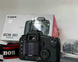 R3 - $300. Canon EOS 30D Digital Camera with battery, battery charger, cap, strap, and manuals.