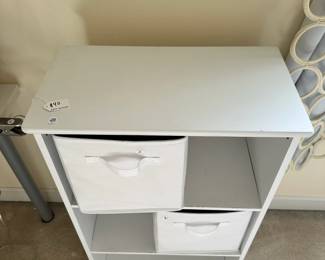 R48 - $30. Small White Shelving Unit. Measures 22" wide x 12" deep x 36" tall. (Baskets priced separately) 