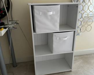 R48 - $30. Small White Shelving Unit. Measures 22" wide x 12" deep x 36" tall. (Baskets priced separately) 