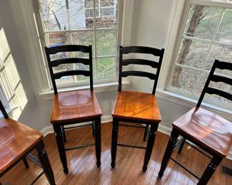 R14 - $100. Set of 4 Wooden Bar Stools. Measures 16" wide x 16" deep x 30" floor to seat. Floor to back is 46" tall. Stained Black & Wooden Seats - all show little bits of wear (scuffs, marks etc.) but all are sturdy!