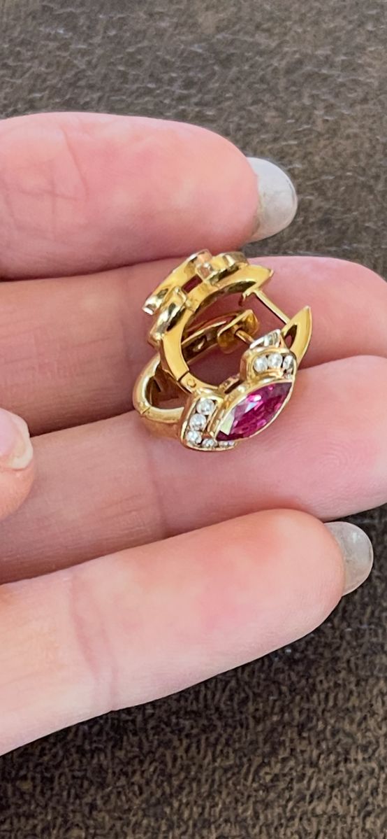 Item 35 - Earrings
One pair of diamond and ruby earrings with the following characteristics:
Total Diamond Weight: 0.25 ct
Earring Attributes
Weight: 5.80 gms
Metal: 18K yellow gold
Design: Clips
Length/Width: 5.3 / 7.5 mm
Manufacturing: Custom wax and cast
Mounting style: Hinged Hoop
Setting: Bezel and Channel set
Condition: Good
Trademark: None
Natural Diamond Melee Attributes
Shape and cut: Round full cut
Weight: 0.01 to 0.015 ct each
Number of diamonds: 20
Total Weight: 0.25 ct (estimated)
Measurements: 1.5 mm
Clarity: VS
Color: G-H
Cut: Good
Polish: Good
Setting: Channel set
Natural Ruby (Corundum) Melee Attributes
Shape and cut: Marquise shaped faceted
Weight: 0.75 ct each
Number: 2
Total Weight: 1.50 ct (estimated)
Measurements: 8.9 x 4.3 mm
Clarity: Type II, Slightly included
Color: Medium dark, Moderately Strong, strongly purplish Red (stpR 6/4) Cut: Good
Polish: Good
Brilliancy: Good - 50% to 70%
$2640