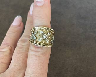 Item 32 - Ring
One vintage estruscan style diamond tapered band with the following
characteristics:
Total Diamond Weight: 0.20 ct
Item Attributes
Weight: 9.40 gms
Metal: 14K yellow gold
Manufacturing: Hand constructed
Condition: Good
Finish: Brushed
Setting: Bead set
Trademark: Marrow
Natural Diamond Melee Attributes
Shape and cut: Round full cut
Weight: 0.01 to 0.066 ct each
Number of diamonds: 15
Total Weight: 0.20 ct (estimated)
Measurements: 1.5 - 2.6 mm
Clarity: VS
Color: G-H
Cut: Good
Polish: Good
Setting: Bead set
$960
