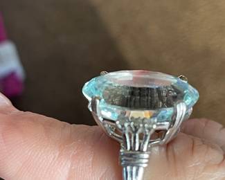One diamond and aquamarine fashion ring with the following characteristics:
Total Diamond Weight: 0.21 ct
Item Attributes
Weight: 8.60 gms
Metal: 14K white gold
Manufacturing: Custom wax and cast
Condition: Good
Finish: Polished
Setting: Prong, bead set
Natural Diamond Melee Attributes
Shape and cut: Round single cut
Weight: 0.035 ct each
Number of diamonds: 6
Total Weight: 0.21 ct (estimated)
Clarity: VS
Color: F-G
Cut: Good
Polish: Good
Natural Aquamarine (Beryl) Attributes
Shape and cut: Oval faceted
Measurements: 20.05 x 15.10 x 9.70 mm (approximate)
Weight: 16.77 ct (actual)
Clarity: Type I, Eye-clean
Color: Very light, Grayish, greenish Blue (gB 2/1)
Cut: Good
Polish: Good
Brilliancy: Good - 50% to 70%
Fluorescence: None (lw)
$2,320