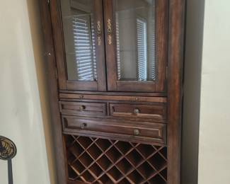 China cabinet - lighted with glass shelves, marble cutting tray, built in wine rack