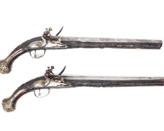 Lot 115 Brace of Ornate Silver Carved Stock Cavalry Pistols, 18th c.