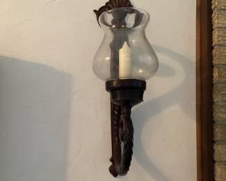 Pair of dark sconces with glass globes