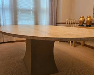 THIS TABLE IS AT ANOTHER LOCATION IN THE AREA: Oval Travertine 2 Piece Dining Table with Metal Base. Seats 6; No Chairs Included