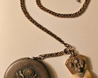 World War I (WWI) military identification locket with attached antique BPOE Elks Lodge Elks tooth gold pendant charm.