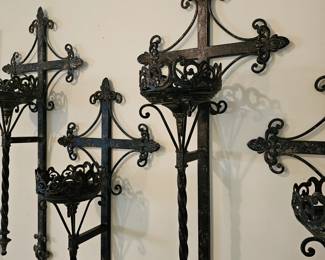 Set of 4 large metal wall candle holders.