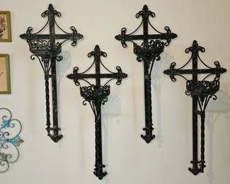 Set of 4 large metal wall candle holders.