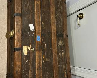 B29 - $30.  Vintage Steamer Trunk used to store clothing in attic.  Still has lots of life left in it.  Measures 34"W 19.25"D x22"T