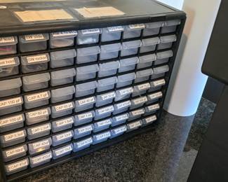 B105 - $25, 64 drawer organizer with various capacitors and miscellaneous