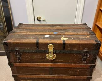 B29 - $30.  Vintage Steamer Trunk used to store clothing in attic.  Still has lots of life left in it.  Measures 34"W 19.25"D x22"T