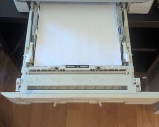 B49 - $200 .  HP Color Laser Jet 2600n Printer and several unopened ink cartridges. Black, Yellow, blue and magenta. 