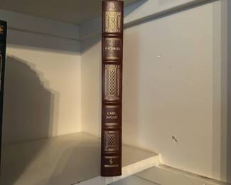 B219 - $175. Cosmos - Carl Sagan. Leather Bound by Wings Books. (shelf 1)