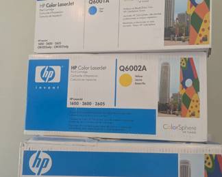 B49 - $200 .  HP Color Laser Jet 2600n Printer and several unopened ink cartridges. Black, Yellow, blue and magenta. 
