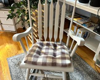 B46 - $40. White Wooden Rocking Chair. Sturdy. Measures 24" wide x 23" deep 29" tall. 