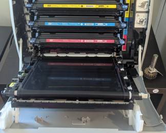 B49 - $200 .  HP Color Laser Jet 2600n Printer and several unopened ink cartridges. Black, Yellow, blue and magenta. 