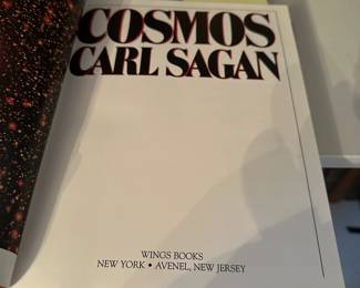B219 - $175. Cosmos - Carl Sagan. Leather Bound by Wings Books.  (shelf 1)