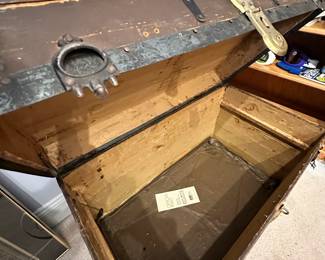 B29 - $30.  Vintage Steamer Trunk used to store clothing in attic.  Still has lots of life left in it.  Measures 34"W 19.25"D x22"T
