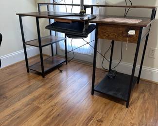 B3 - $40. Office desk (has been modified by owner to add slide out keyboard tray.) Measures 55.25” x 22” deep x 34.5” tall. 
