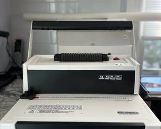B22 - $120.  Coil (Spiral) Binding Machine Comes with Manual and several size coils. 