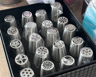 Decorator tips! Tons of bakery tools, measuring cups, mixing bowls,, baking sheets, molds, baking mats, and much more!
