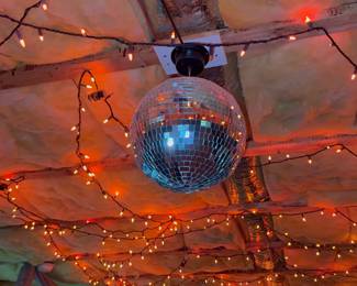 Disco ball with orange Halloween lights