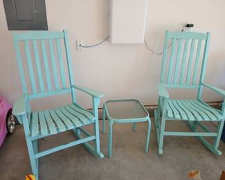 Blue wood outdoor rocking chairs.