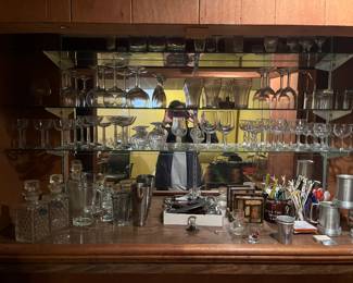 Multiple sets of glasses and various bar wear. 