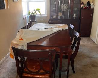 Mahogany double leg dining table and 6 matching chairs.  Mahogany China Cabenit 