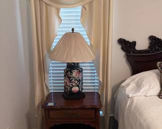 nightstand and floral lamp